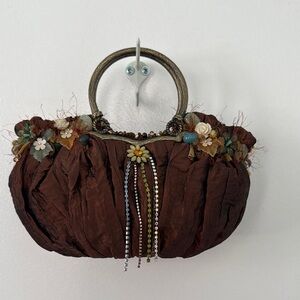 Elegant Brown Handbag with Floral Accents